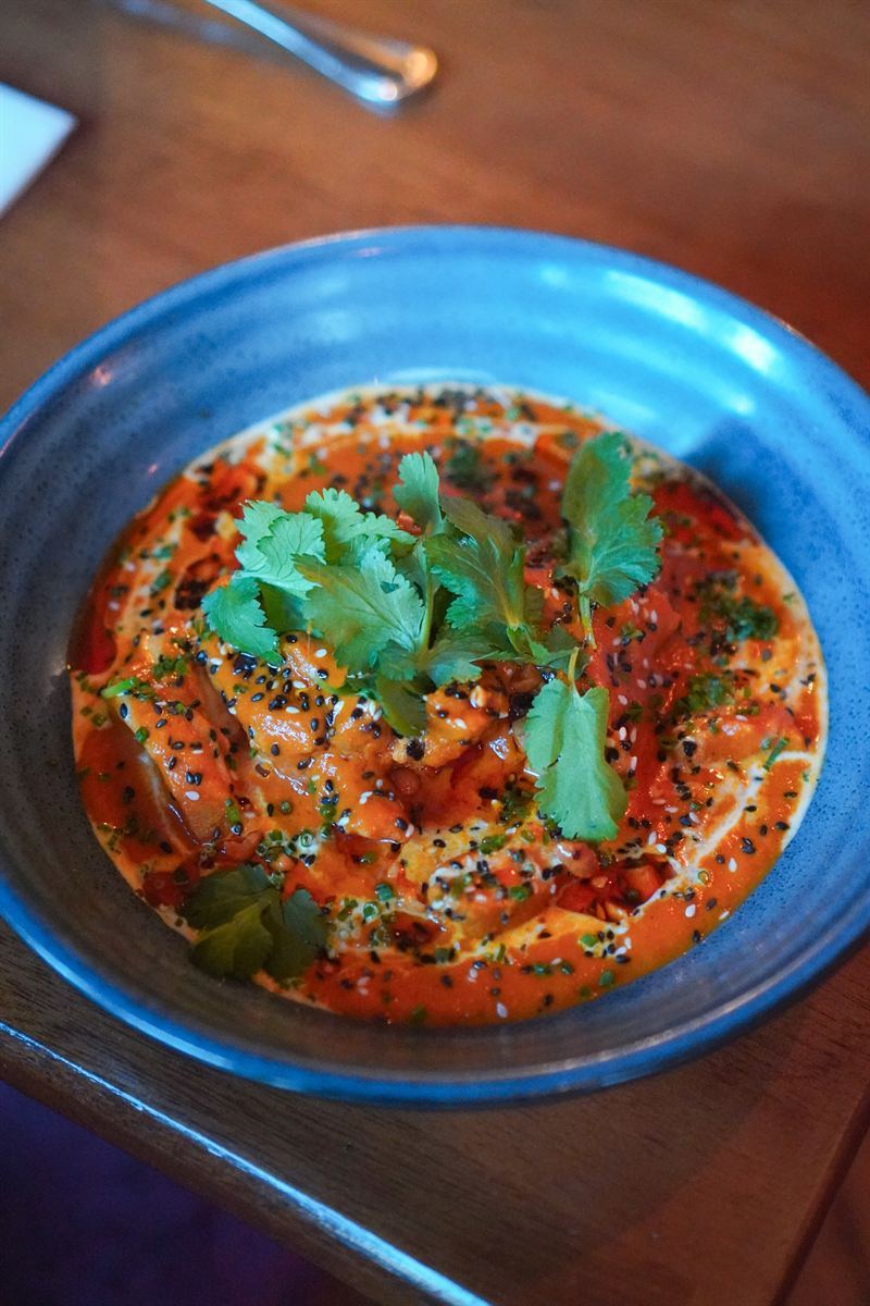 Butter chicken curry topped with coriander